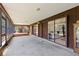 Long screened porch with access to different rooms and the yard at 1315 Pine Needle Rd, Venice, FL 34285