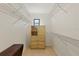 Well-organized walk-in closet with built-in shelving and storage at 1315 Pine Needle Rd, Venice, FL 34285