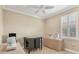 Bright bonus room with natural light, ceiling fan and multiple sewing machines on tables for creative endeavors at 13334 Pacchio St, Venice, FL 34293