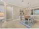 Dining room featuring a chandelier, a dining table set for six, and a view of the outdoors at 13334 Pacchio St, Venice, FL 34293