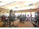 Well-equipped fitness center with modern exercise equipment and ample natural light for an active lifestyle at 13334 Pacchio St, Venice, FL 34293