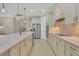 Modern kitchen featuring stainless steel appliances, sleek countertops, and ample cabinet space at 13334 Pacchio St, Venice, FL 34293