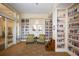 Cozy library featuring built-in bookshelves, comfortable seating, and a welcoming atmosphere for reading at 13334 Pacchio St, Venice, FL 34293