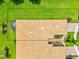 Birds eye view of roof and backyard showcasing manicured lawn, gardens, and screened lanai at 13913 Alafaya St, Venice, FL 34293