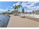 Scenic waterfront boardwalk with seating, offering tranquil views of the lake at 13913 Alafaya St, Venice, FL 34293