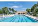 Spacious community pool with lap lanes and lounge chairs, perfect for relaxation at 13913 Alafaya St, Venice, FL 34293