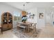 Cozy dining room with a wooden table, chairs, and a built-in cabinet at 13913 Alafaya St, Venice, FL 34293