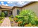 Charming home with lush landscaping and brick walkway at 13913 Alafaya St, Venice, FL 34293