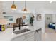 Bright kitchen features quartz countertops, stainless steel appliances, and stylish pendant lighting at 13913 Alafaya St, Venice, FL 34293