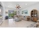 Inviting living room with a comfortable sectional sofa and an outdoor patio view at 13913 Alafaya St, Venice, FL 34293