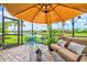 This beautiful patio shows comfortable seating, pond views, and lush landscaping at 13913 Alafaya St, Venice, FL 34293