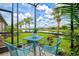 Comfortable seating with patio surrounded by lush landscaping and beautiful pond views at 13913 Alafaya St, Venice, FL 34293