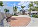 A street in a tropical community with a bench, brick road, and several stores at 13913 Alafaya St, Venice, FL 34293