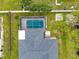 Overhead view featuring roof, screened pool, and lush backyard greenery at 1536 Porpoise Rd, Venice, FL 34293