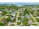 Scenic aerial view of a waterfront community, with homes nestled among lush greenery and waterways, offering a tranquil coastal lifestyle at 1536 Porpoise Rd, Venice, FL 34293