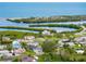Community aerial view of waterfront homes, canals, and lush green foliage at 1536 Porpoise Rd, Venice, FL 34293