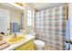 The bathroom features a shower/tub combo, a window, and a yellow sink at 1536 Porpoise Rd, Venice, FL 34293