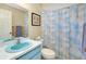 The bathroom features a shower/tub combo and a light-blue vanity at 1536 Porpoise Rd, Venice, FL 34293