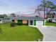 Charming single-story home with a well-manicured lawn, attached garage, and inviting curb appeal at 1536 Porpoise Rd, Venice, FL 34293