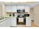The kitchen features stainless appliances at 1536 Porpoise Rd, Venice, FL 34293