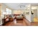 Comfortable living room with hardwood floors, neutral walls, and an inviting leather sofa at 1536 Porpoise Rd, Venice, FL 34293