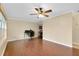 Spacious living room with hardwood floors and a ceiling fan at 1536 Porpoise Rd, Venice, FL 34293