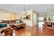 Spacious living room with hardwood floors, an open layout, and views into other rooms at 1536 Porpoise Rd, Venice, FL 34293