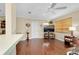 Functional living room showcasing hardwood floors, neutral walls, and access to the front door at 1536 Porpoise Rd, Venice, FL 34293