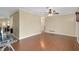 Bright living room with hardwood floors and ceiling fan at 1536 Porpoise Rd, Venice, FL 34293