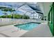 The pool is enclosed by a screen and a privacy fence at 1536 Porpoise Rd, Venice, FL 34293