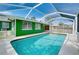 Relaxing screened-in pool with clear blue water, offering a refreshing escape from the Florida heat at 1536 Porpoise Rd, Venice, FL 34293