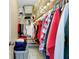 The walk-in closet features built-in shelving and storage for clothes and accessories at 1536 Porpoise Rd, Venice, FL 34293
