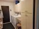 Functional laundry room with sink and plenty of storage at 1608 E Cypress Point Dr, Venice, FL 34293