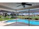 Screened-in pool with beautiful views of the neighborhood pond at 1608 E Cypress Point Dr, Venice, FL 34293