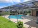 Relax by the pool in this large screened in lanai at 1608 E Cypress Point Dr, Venice, FL 34293