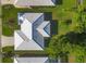 An aerial view displays the roof and lawn of a property at 1614 Quail Lake Dr, Venice, FL 34293