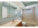 Neutral bathroom featuring tub-shower combo and a single sink vanity with tile floors at 1614 Quail Lake Dr, Venice, FL 34293