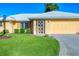 Attractive single-story home with a well-maintained lawn and an attached single-car garage at 1614 Quail Lake Dr, Venice, FL 34293