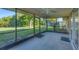 Screened in lanai with view of the lawn at 1614 Quail Lake Dr, Venice, FL 34293