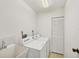 Bright laundry room with side by side washer and dryer and tiled floors at 1614 Quail Lake Dr, Venice, FL 34293