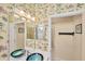 Bathroom view with a glass sink, jungle themed wallpaper, and an entry way to the shower and toilet at 1620 San Silvestro Dr, Venice, FL 34285