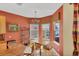This dining area features a chandelier, art, and a large window with a view at 1620 San Silvestro Dr, Venice, FL 34285