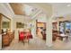 Elegant dining room with decorative ceiling, wood floors, and easy access to living room at 1620 San Silvestro Dr, Venice, FL 34285