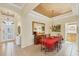 Formal dining room featuring wainscotting, tiled floor, and chandelier at 1620 San Silvestro Dr, Venice, FL 34285