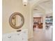 Bright foyer leading to main living areas with archways and lake view at 1620 San Silvestro Dr, Venice, FL 34285