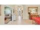 Bright foyer with tiled floors and ample natural light streaming through the glass front door at 1620 San Silvestro Dr, Venice, FL 34285