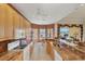 Lovely kitchen featuring granite counters, views of the water, and wood cabinetry at 1620 San Silvestro Dr, Venice, FL 34285