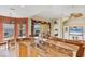 Bright eat-in kitchen featuring granite counters, stainless sink, and a beautiful water view at 1620 San Silvestro Dr, Venice, FL 34285