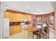 Kitchen with granite counters, a large island, and stainless appliances at 1620 San Silvestro Dr, Venice, FL 34285