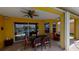 Outdoor dining on a screened lanai, perfect for entertaining with great natural lighting at 1620 San Silvestro Dr, Venice, FL 34285